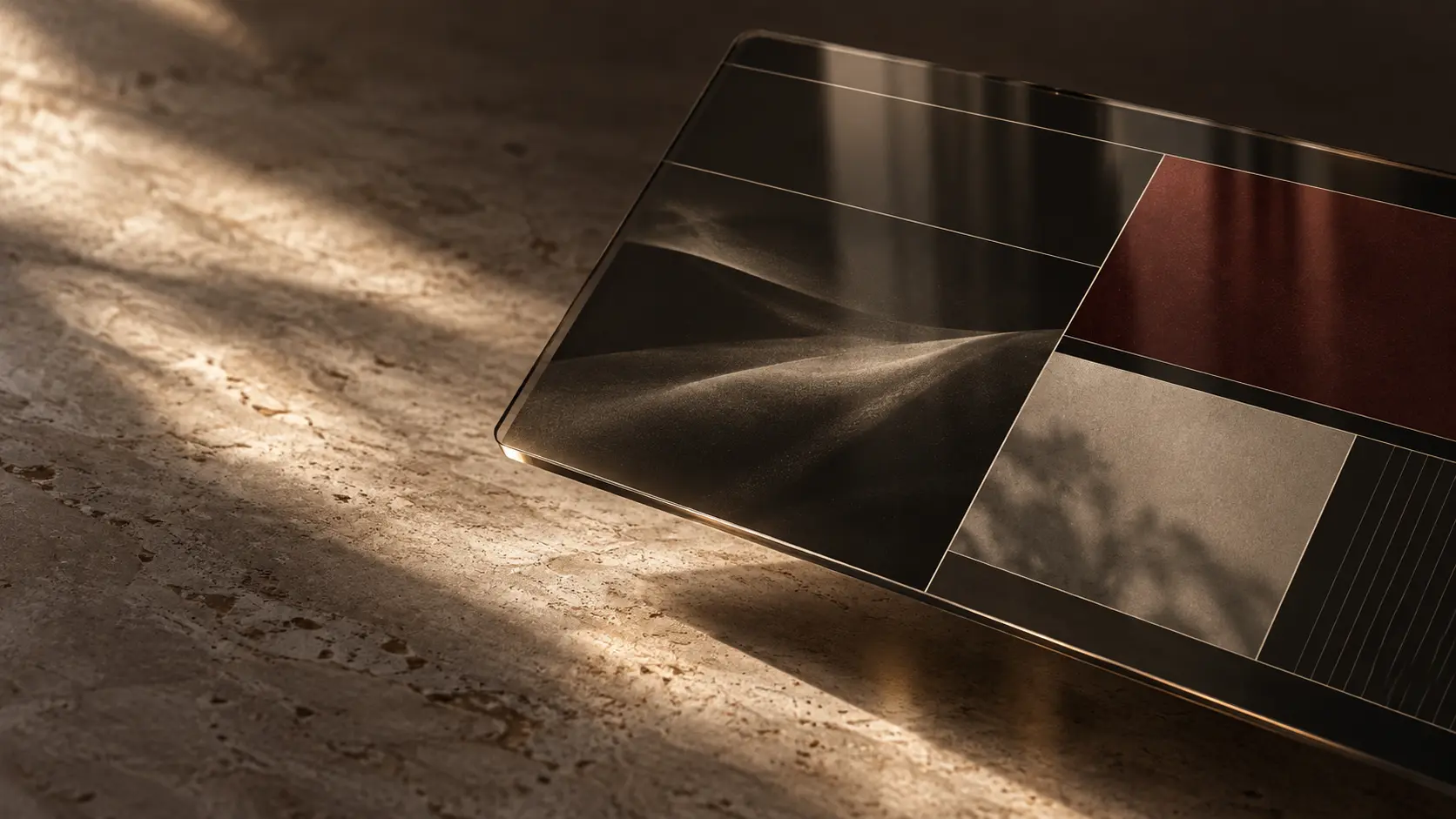 A smoked-glass interface plane with an editorial grid resting in warm directional light.